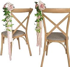 two wooden chairs decorated with flowers and ribbons