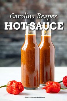 two bottles filled with hot sauce next to some red peppers on a white surface and the words carolina reaper hot sauce