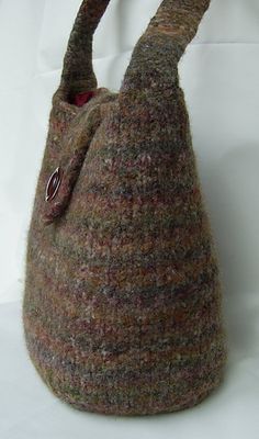 a handbag made out of yarn with a handle