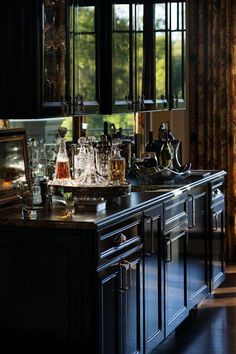 a kitchen filled with lots of bottles and glasses