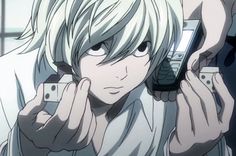 an anime character holding a cell phone up to his ear