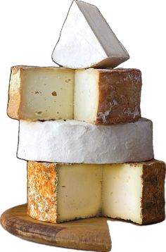 several different types of cheese stacked on top of each other