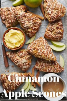 cinnamon apple scones on a baking sheet with apples, cinnamon sticks and caramel sauce