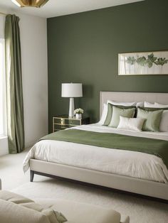 a bedroom with green walls and white bedding, two lamps on either side of the bed