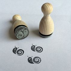 two rubber stamps sitting on top of a piece of paper