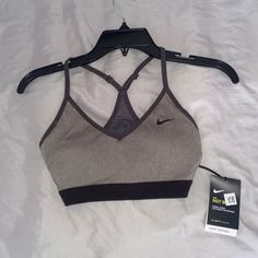 Gray And Black Nike Sports Bra Brand New! Women’s Size Medium Nike Gray Activewear For Sports Events, Gray Sports Bra For Gym, Gray Fitted Sports Bra For Workout, Gray Racerback Sports Bra For Running, Gray Sports Bra For Workout, Casual Gray Racerback Sports Bra, Casual Gray Sports Bra For Training, Gray Sports Bra With Light Support, Sporty Gray Sports Bra For Running