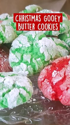 christmas gooey butter cookies are sitting on a glass plate with red and green frosting