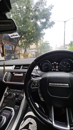 the interior of a car with dashboard and gauges