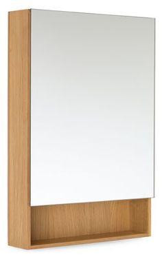 a wooden shelf with a mirror on the top and an empty white board below it