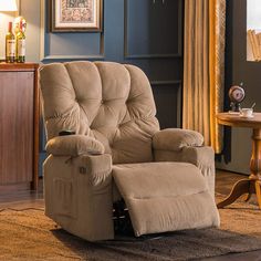 a living room with a recliner chair in it's center and a rug on the floor