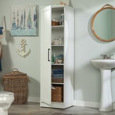 a bathroom with a white cabinet and sink