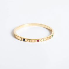 💍 14k Solid Gold Personalized Name Ring featuring custom names and birthstones, available in yellow, rose, or white gold. This minimalist stacking ring is perfect for celebrating family and loved ones. 🌟 Perfect For: Birthdays, Anniversaries, Mother's Day, or any special occasion. Order now to create a unique and meaningful keepsake! ✨ Material: Solid Gold (Not gold plated or gold fill) Karat: 14k (585) (ask me for 18K gold) Width of the band: 1.5 mm Available gold color: Yellow, rose, white Gemstone: Cz (Cubic Zirconia)   M o r e  *  F r o m  *  U s   Goldstore Jewelry - https://etsy.me/3gHtcrZ * Editor's Pick - https://etsy.me/3CCLlmm * Cremation Urn Jewelry - https://etsy.me/3MM0Lcq * Name Ring - https://etsy.me/3pVTAEU * Cross Ring - https://etsy.me/3ME16ho * Birthstone Ring - https: Ring With Birthstones, Family Ring, Family Rings, Name Ring, Masonic Ring, Name Rings, Evil Eye Ring, Cross Ring, Family Celebrations