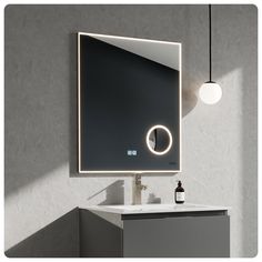 a bathroom sink with a mirror above it and a light hanging from the ceiling over it