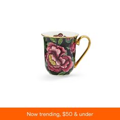 a coffee cup with flowers painted on it and the words now trending $ 50 & under