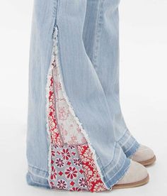 a woman's legs in jeans and shoes