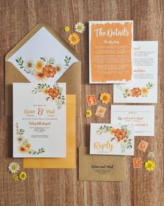 an orange and yellow wedding suite with matching envelopes, rsp cards, and postage