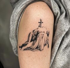 a person with a cross on their arm