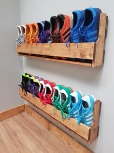 there are many pairs of shoes hanging on the wall