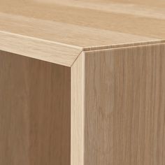 a close up view of the top of a wooden cabinet with wood grained finish