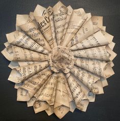 a paper flower made out of sheet music