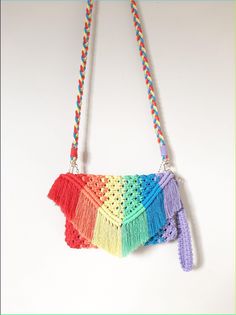 a multicolored crocheted purse hanging from a string