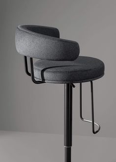 a black and grey stool with two barstools on it's backrest