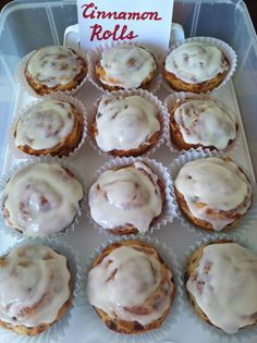 a tray filled with cupcakes covered in frosting