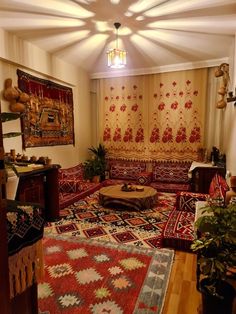 a living room filled with lots of furniture and rugs