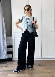 As someone who loves wearing denim jackets, a button-front denim vest is a perfect summer wardrobe piece to layer over other items like a t-shirt (unbuttoned or done up) or on its own. You can wear denim vests for casual summer outfits or business casual ensembles. I love to pair them with stylish black wide leg pants and over striped tee for a classic look look!  Explore all the easy ways to style a light denim vest outfit this summer (or a denim waistcoat outfit as some are calling it!) in a relaxed and effortless way. It's the perfect addition to any casual summer outfit! Outfits With Denim Vest, Jean Vest Outfits Fall, Denim Waistcoat Outfit, Joyful Outfits, Denim Waistcoat Outfit Woman, Denim Vest Outfit Aesthetic, Outfits With Vests For Women, Striped Tee Outfit