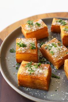 some food that is sitting on a plate with sprinkled parmesan cheese