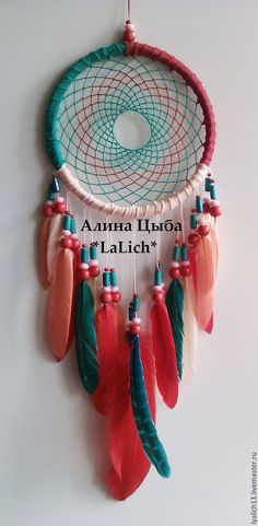 there is a colorful dream catcher hanging on the wall