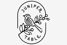 a bird sitting on top of a table next to a sign that says jumper table