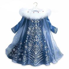 a blue dress with white snowflakes on it and fur collared neckline