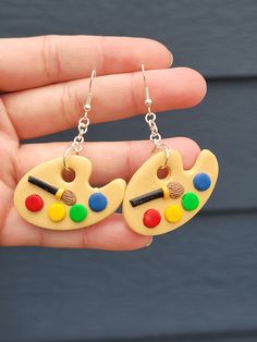 These earrings are the perfect gift for teachers and students alike!! All of the earrings are handcrafted using polymer clay, baked, sanded, assembled, and then sealed with a high gloss varnish.  ⭐️They are super lightweight and have no pull on the ear⭐️ ⭐️ Please note that the earrings are handmade with clay and are fragile. Please do not bend or they may break. Each earring is handmade, therefore there will be slight variations in size and color. Making each one unique in its own way. The earrings are Nickel and Lead-Free STAY CONNECTED: To get the latest on my shop, please check out @Knotty4Klay on Instagram! Please feel free to share pictures and tag my shop on Instagram. You can also follow us on TikTok: @Knotty4Klay Don't hesitate to contact me with any questions, comments, or concer Polymer Clay Teacher Gift, Teacher Clay Earrings, Paint Pallette, Teacher Appreciation Gift Ideas, Appreciation Gift Ideas, Teacher Earrings, Anime Earrings, Color Making, Diy Teacher Gifts