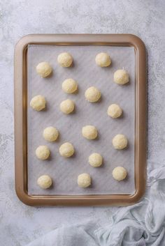 doughnut holes on a baking sheet ready to be baked