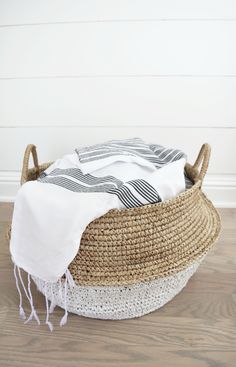 Two collapsible woven Hyacinth Storage Accent Baskets styled in livingroom with blankets inside. Handmade in Bali using natural and white painted water hyacinth. - Saffron and Poe Throw Blanket Basket Modern, Large Basket For Throw Blankets, Baskets Neutral, Hyacinth Basket, Rv Mods, Blanket And Pillow, Getting Organized At Home, Storing Blankets, Rv Decor