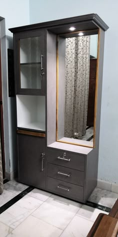 an armoire with drawers and a mirror