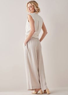 Light and flowy in a flatteringly full leg palazzo, these smocked waist stripe chambray pants wear like a dream. Separate elastic smocked waist is soft and comfortable while clever sideseam pockets are convenient and discreet. Available in Navy, Soft Beige. 55% Linen, 45% Viscose. High rise, full length. Avg model height approx 5ft 9in, inseam approx 30-31in. Chambray Pants, Stripe Pants, Beige Pants, Wool Shop, Soft Beige, Palazzo Pants, Linen Pants, Chambray, Blue Stripes