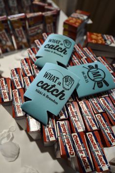 candy bar wrappers sitting on top of a table next to boxes of chocolates