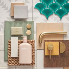 bathroom items displayed on tiled wall with geometric shapes and colors in the backround