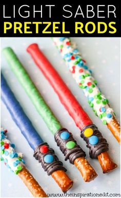 four different colored candles with the words light saber pretzel rods