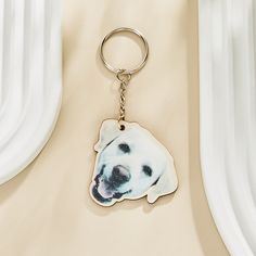 a keychain with a photo of a dog on it