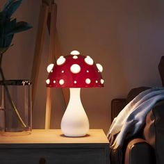 a mushroom shaped lamp sitting on top of a table