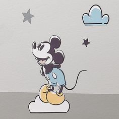 a cartoon mouse sitting on top of a cloud