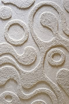 an abstract wallpaper design with wavy lines and swirls on the surface, in white