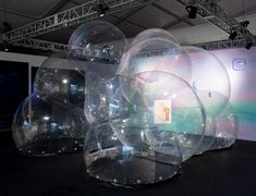 several clear bubble like objects are on display