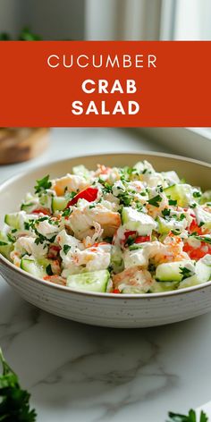 cucumber crab salad in a white bowl on a marble table with text overlay