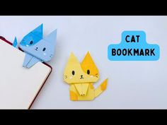 an origami cat is next to a bookmark with the words,'cat bookmark '