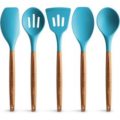 four blue spatulas with wooden handles are lined up in a row