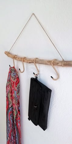 two purses are hanging on a wall